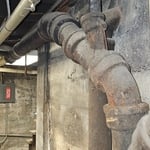 Removed old cast iron pipes that were leaking in unfinished basement in a church. Installed pvc .