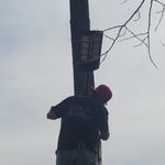 Sixto, owner/ skilled craftsman, wrapping up a solar light at the Henry's residence.