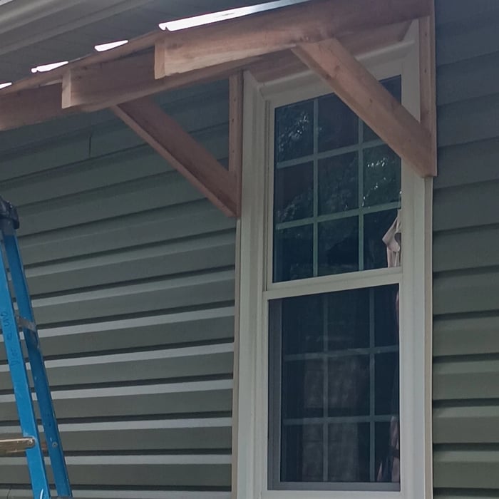Cedar awning with galvanized roof