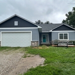 Farm home - new roof and siding - client-designed.