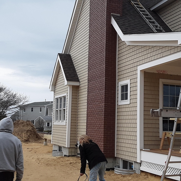 Left side, the chimney was siding as well not real brick
