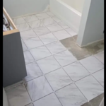 The new vinyl tub/shower installed, the walls and ceiling painted in two coats of semi gloss paint, the vanity; sanded, two coats of satin finish paint (new granite countertop with a new under mount sink and new hardware was also installed).