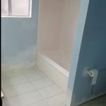Before: guest bathroom make over; the new vinyl tub/flooring/baseboards and paint.