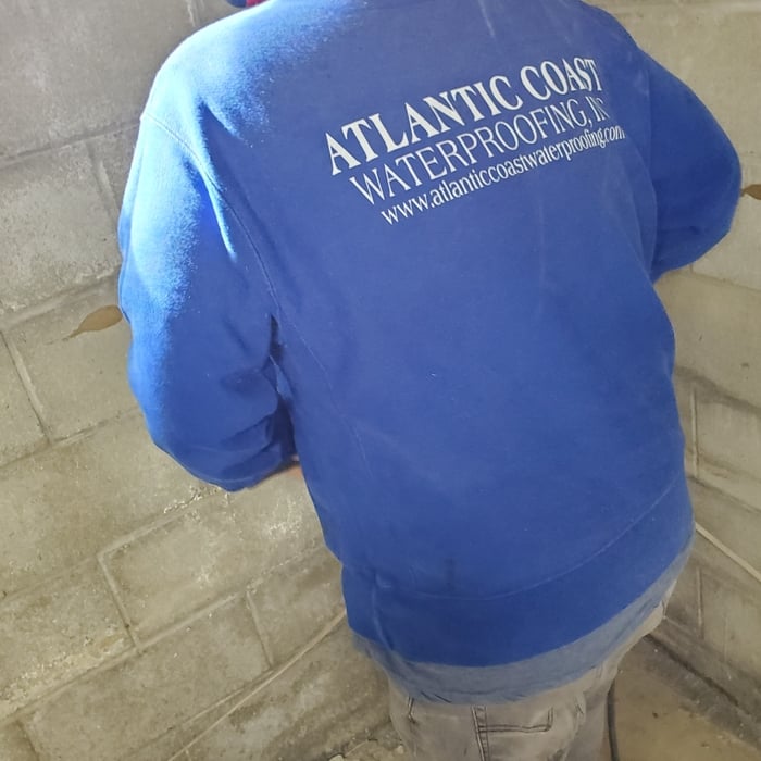 Removing the perimeter of the basement floor slab.