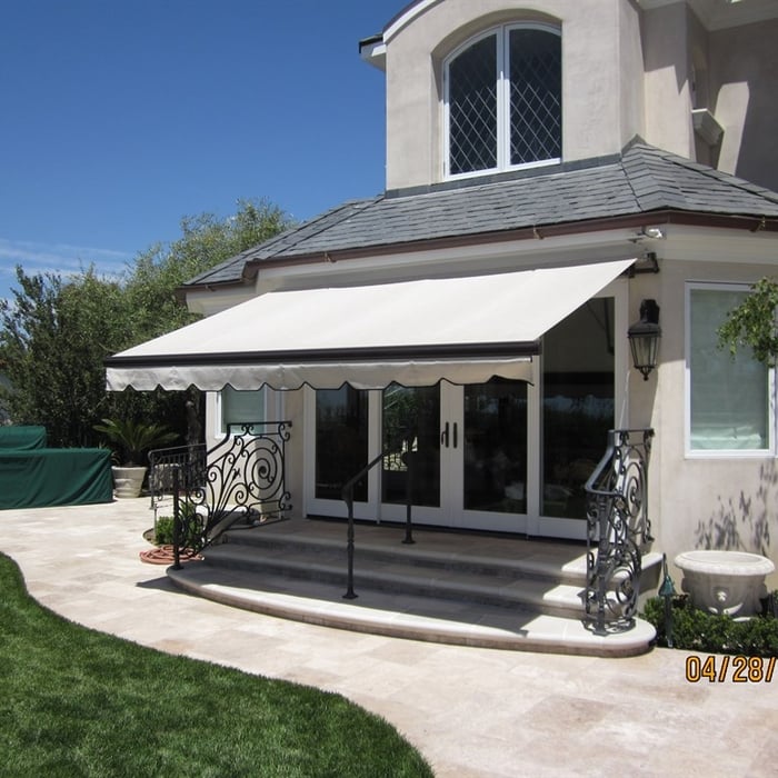 Retractable Awning protecting rear patio doors