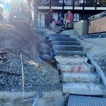Large stone stairway to jacuzzi and boat dock