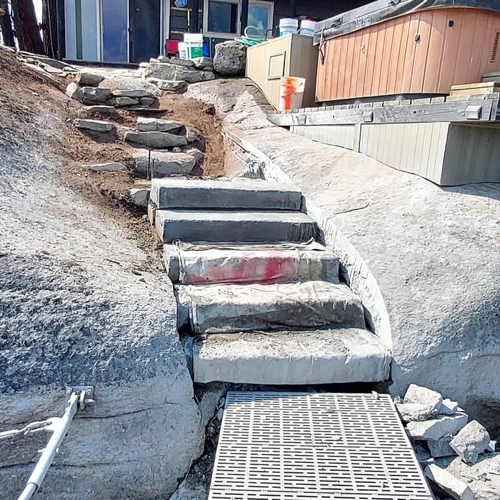 Large stone stairway to jacuzzi and boat dock