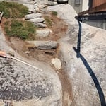 Large stone stairway to jacuzzi and boat dock