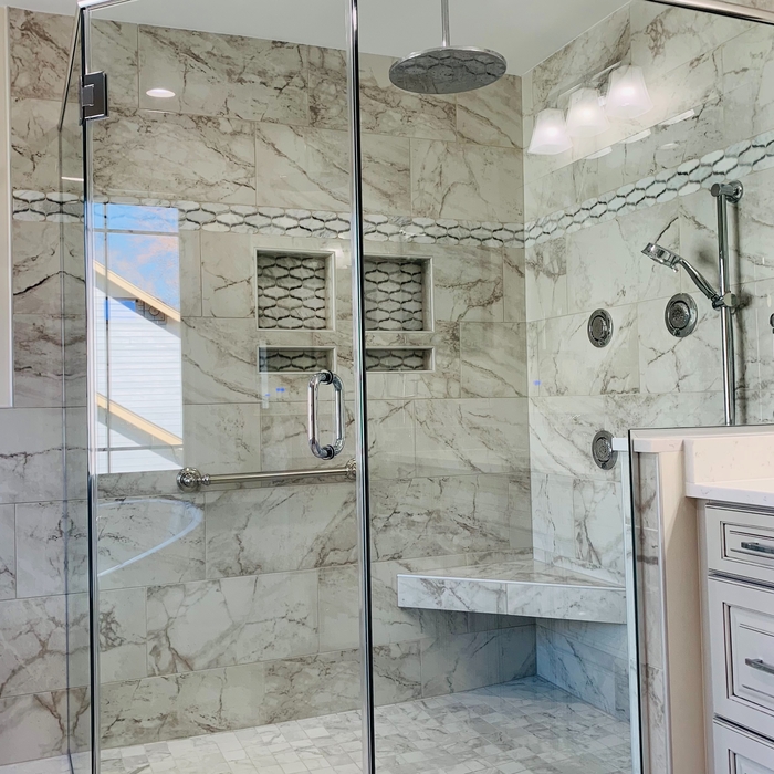 Barrier free shower with custom glass enclosure.