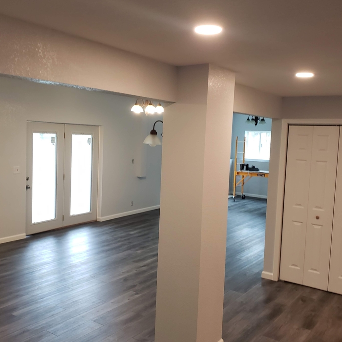 Basement was bare. Installed framing, Sheetrock, paint, flooring, trim, etc.