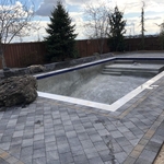 Pool paver deck with retaining and landscape