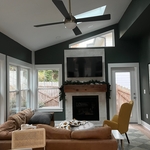 Sunroom Addition with triangular window matching opposite side and extra door to allow another access to it.