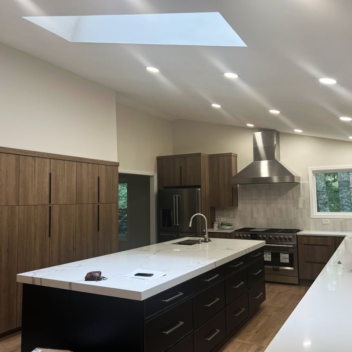 Large Kitchen with two sinks installed in different locations, lots of cabinetry space, drawers and kitchen accesories