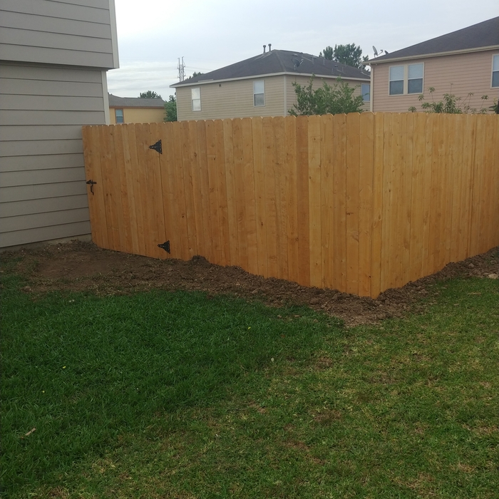 Pressure treated wood with 6 inch wide gate .