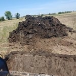 Piling dirt.