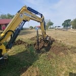 Pond digging. Water line trenches.