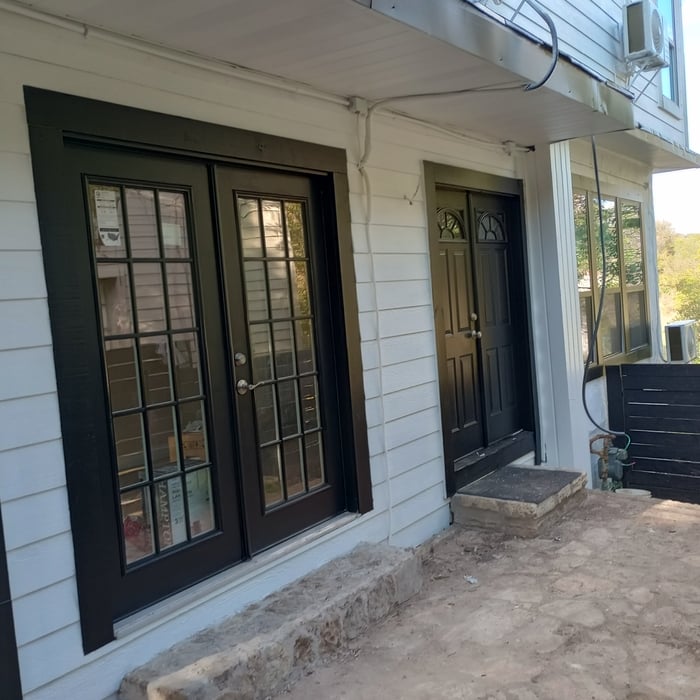 another beautiful postcard of siding in white and black doors