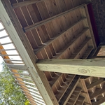 6x6 are notched so that the band sits inside the notch and is double lag bolted.