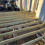 Framing with double just in front of chimney so that the weight of the deck is not on the chimney.