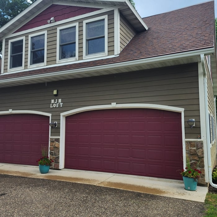 West side of barn, trim, siding and garage door painting.