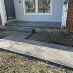 Textured stamp concrete walkway and front porch