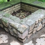 Had to rebuild about one third of the fire pit then repointed the rest of it and this is the finished product.