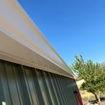 Gutter and snow stop installation on shop