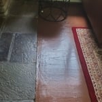 This is the client's den area where the floors were refinished. There is a long list of major errors. Here it starts with dreadful sanding resulting in drum marks & edger digs, incomplete sanding, completely botched staining, and a horrible 'finished' product!
