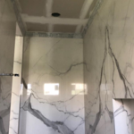 Large Format book match tile Installation with mitered edges.