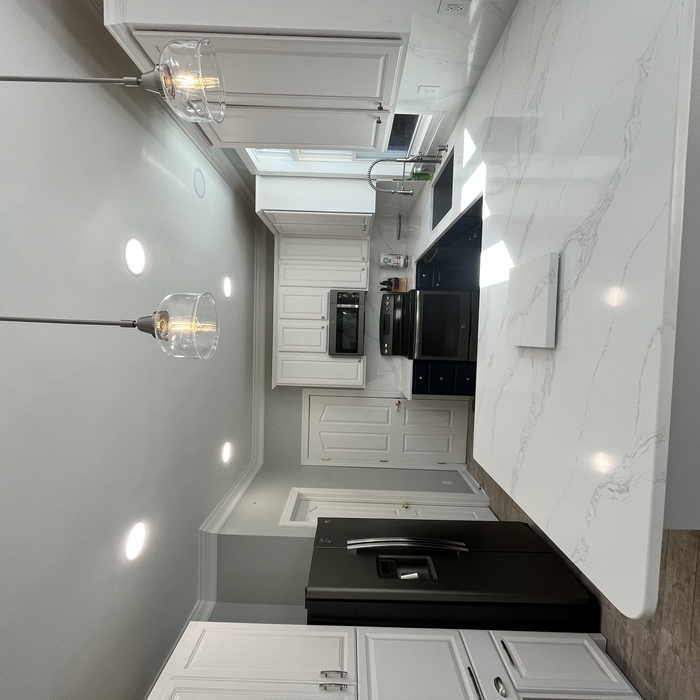 Complete kitchen n remodel, Painted cabinets, new quartz countertops that were also use as backsplash, electrical, custom built pantry