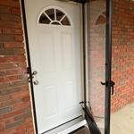 New door installed and storm door ready-installed.