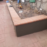 Stucco repair and synthetic color on a flower bed