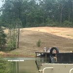 Some sloping hydro seeding and dock building on a property