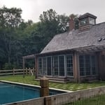 Pool House Exterior with Floor-to-Ceiling Windows & Doors, Two Pergolas, & Cupola with Windows