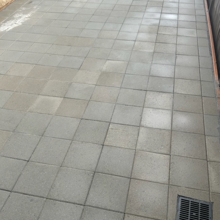 This was one the side driveway of the house built it with a pallet of concrete pavers in grey.
