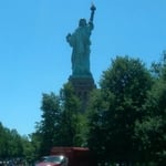 at rear base of ststue ON Liberty Island