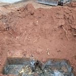 Overfilled tank and rotted baffle, shows excessive solids and not maintained