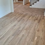Solid white oak with herringbone entry and inlayed hall