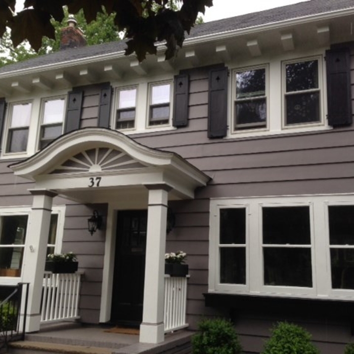 This wood siding for this house was sanded down to bare wood and then primed with oil and painted