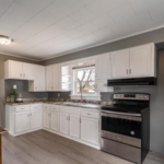 New countertops, new sink and faucet, painted existing cabinets, new hardware, new stove, and new fridge will arrive soon.