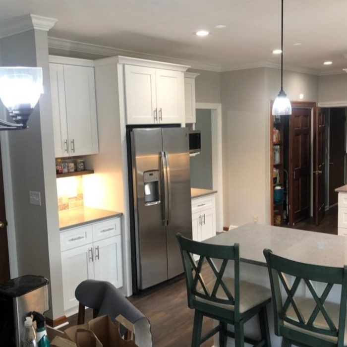 Removed soffits above cabinets and peninsula to open space up