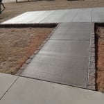 Regular brush finishing with stone install around the edge of the patio