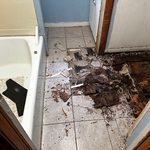 Breaking through the old floor to restructure and finish.