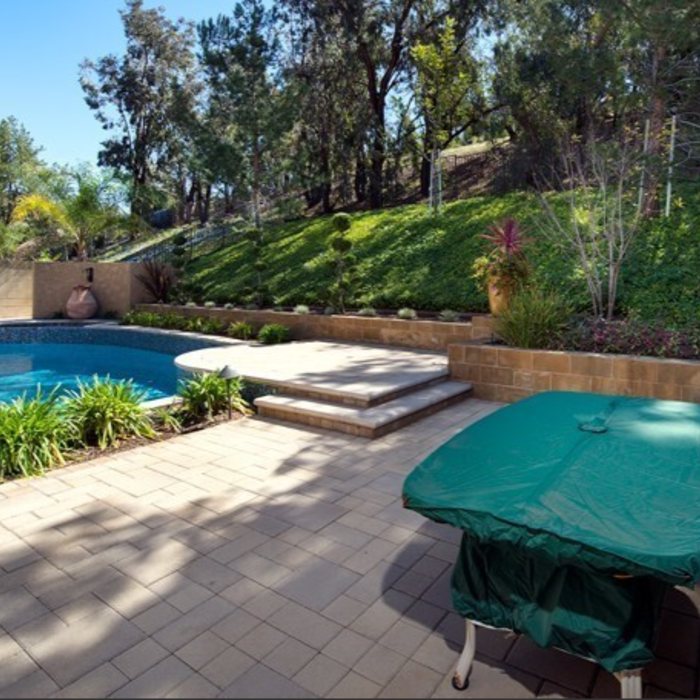 Pool deck pavers, retaining walls, and elevated patio pavers
