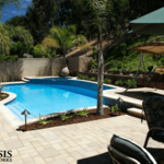 Pool and deck remodel including retaining walls, pool coping, tile, plaster, and water features with lights