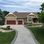 Upgrade your curb appeal with a Brushed Concrete Driveway featuring decorative stamped borders