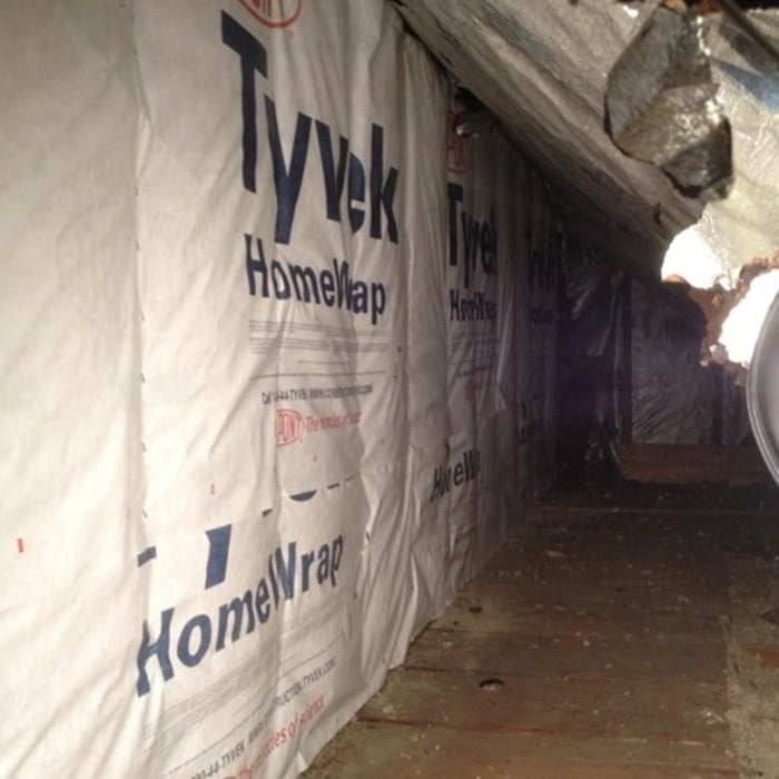Lastly, the Tyvek is installed over the new insulation