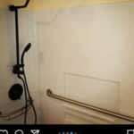 Installed new handicap accessible shower surround, new shower valve, new grab bars.