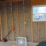 Faced fiberglass wall insulation