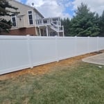 Straight line white privacy fence
